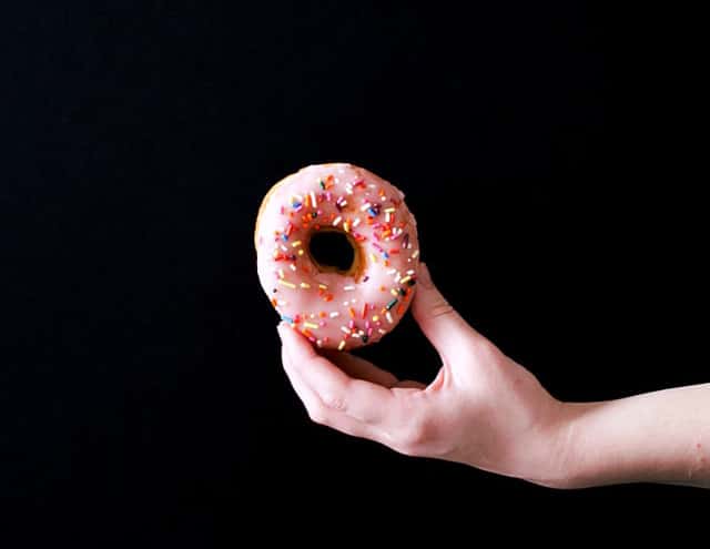 dunkin' donut held by hand