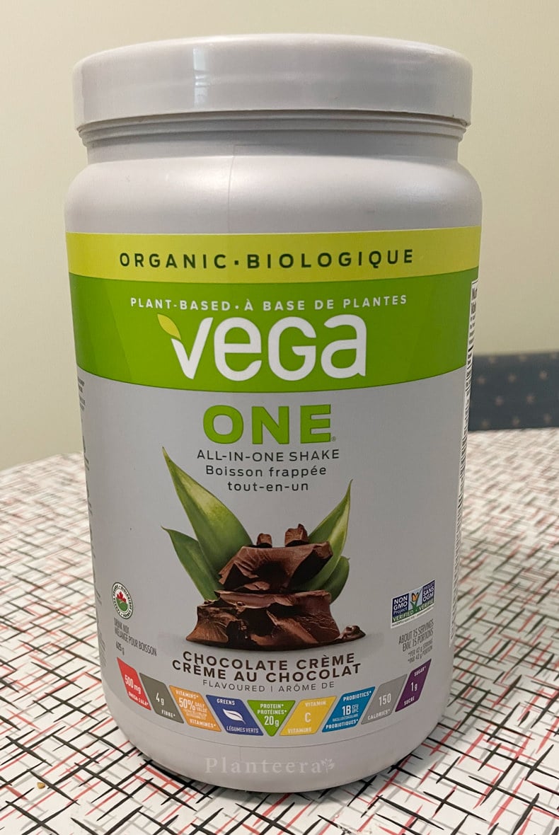 chocolate flavor tub of Vega One All-in-One Shake